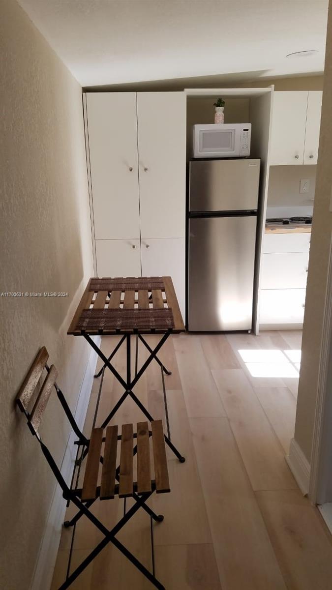 a view of a room with rack and wooden floor