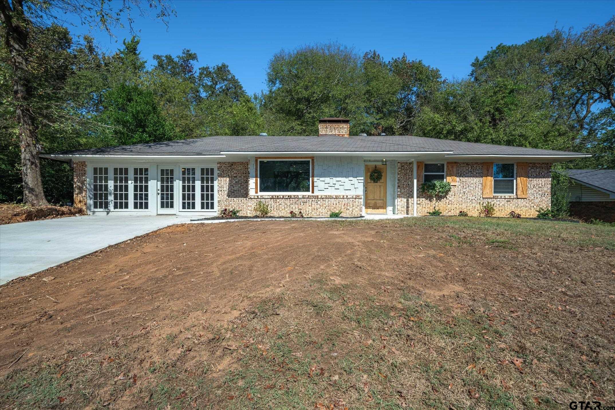 front view of a house with a yard