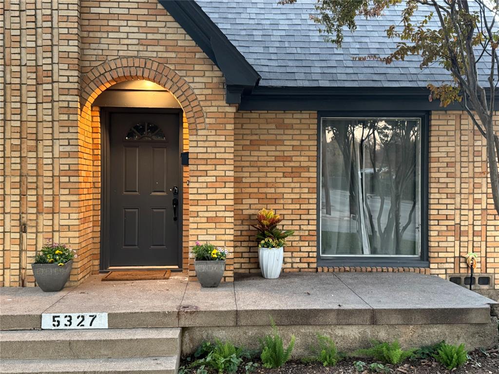 a front view of a house with garage