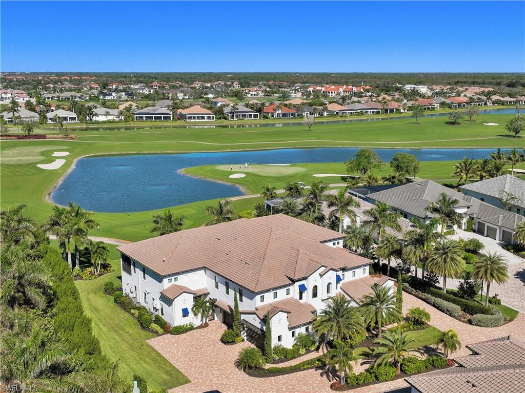 an aerial view of a house with outdoor space swimming pool and ocean view