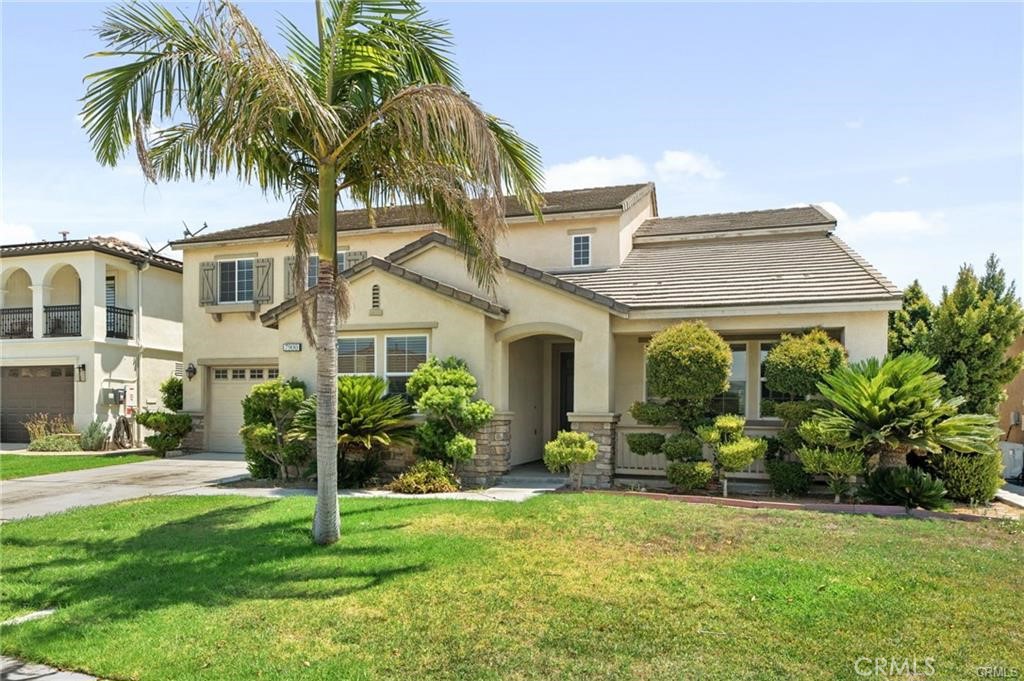 a front view of house with yard and green space