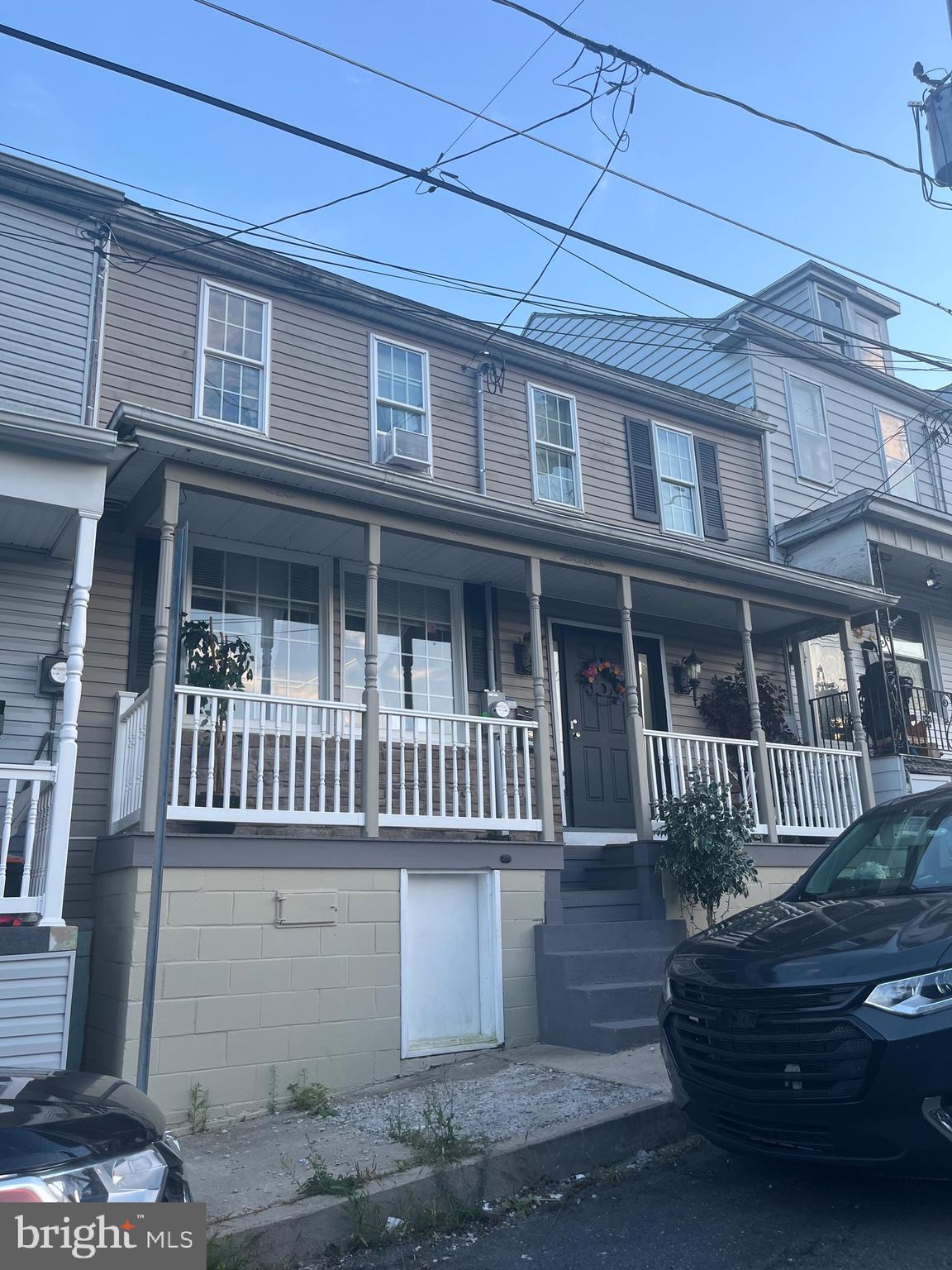 a front view of a house with stairs