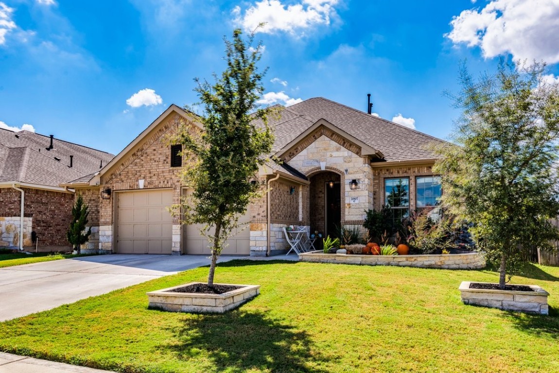 a front view of a house with swimming pool yard and outdoor seating