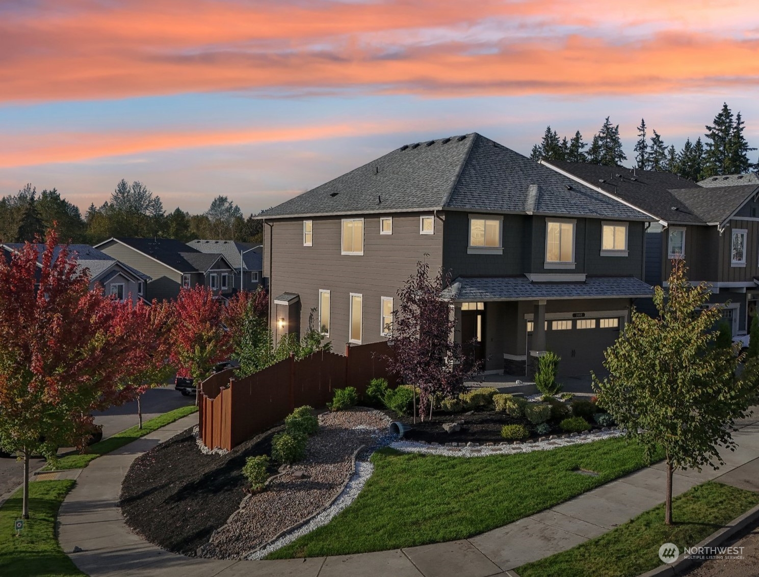 a front view of a house with a yard