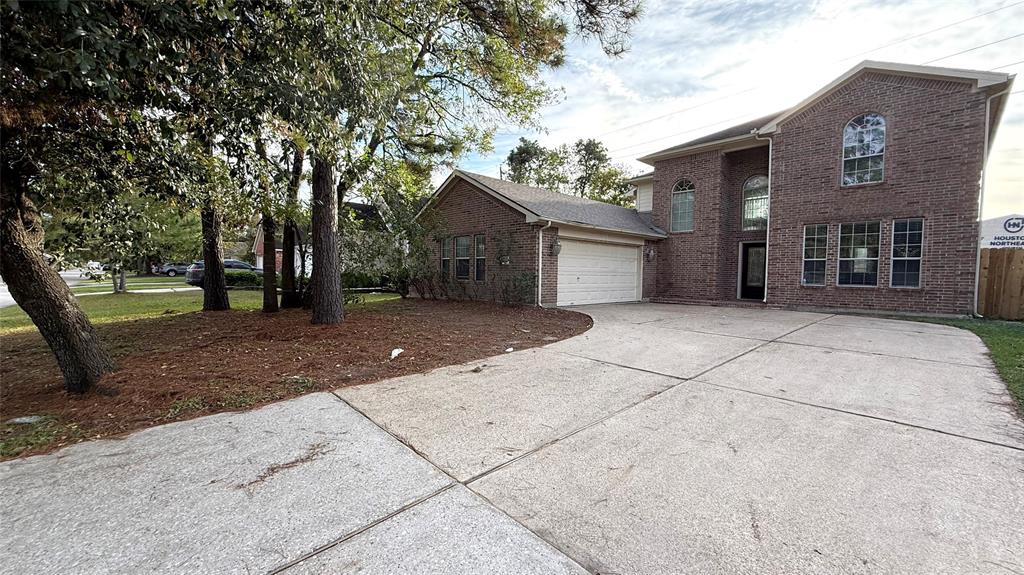 a view of a house with a tree