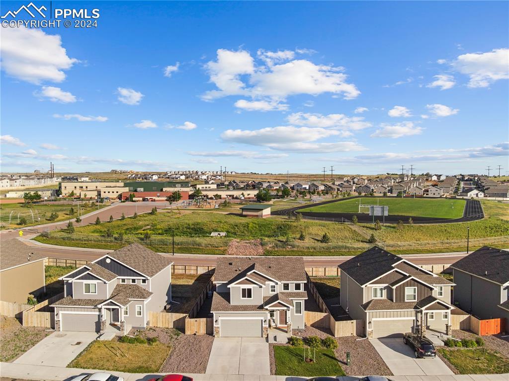 an aerial view of a house with a ocean view