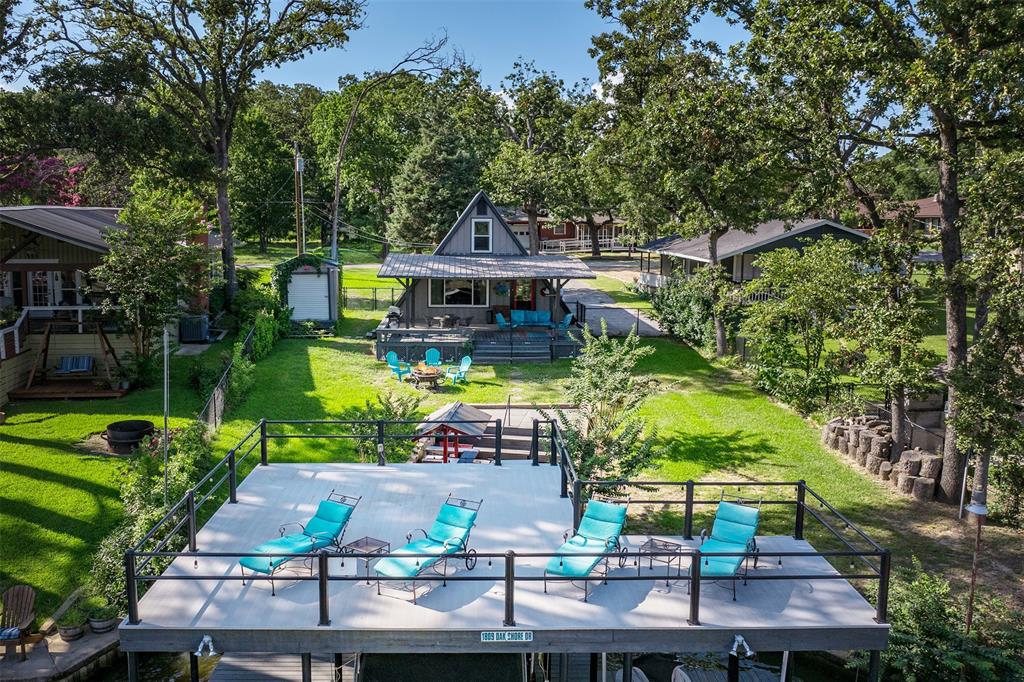 an aerial view of a house with swimming pool garden and patio