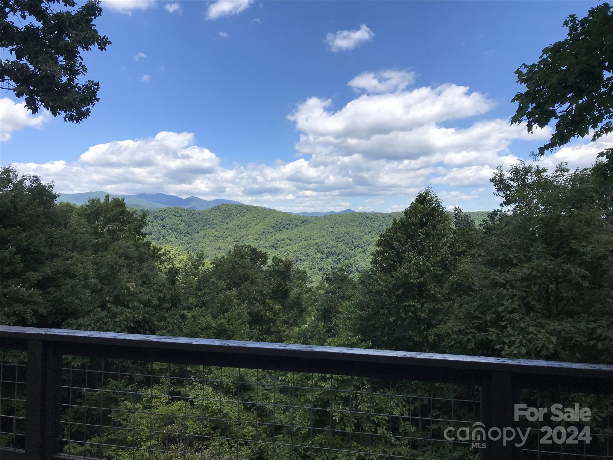 a view of a balcony with an outdoor space