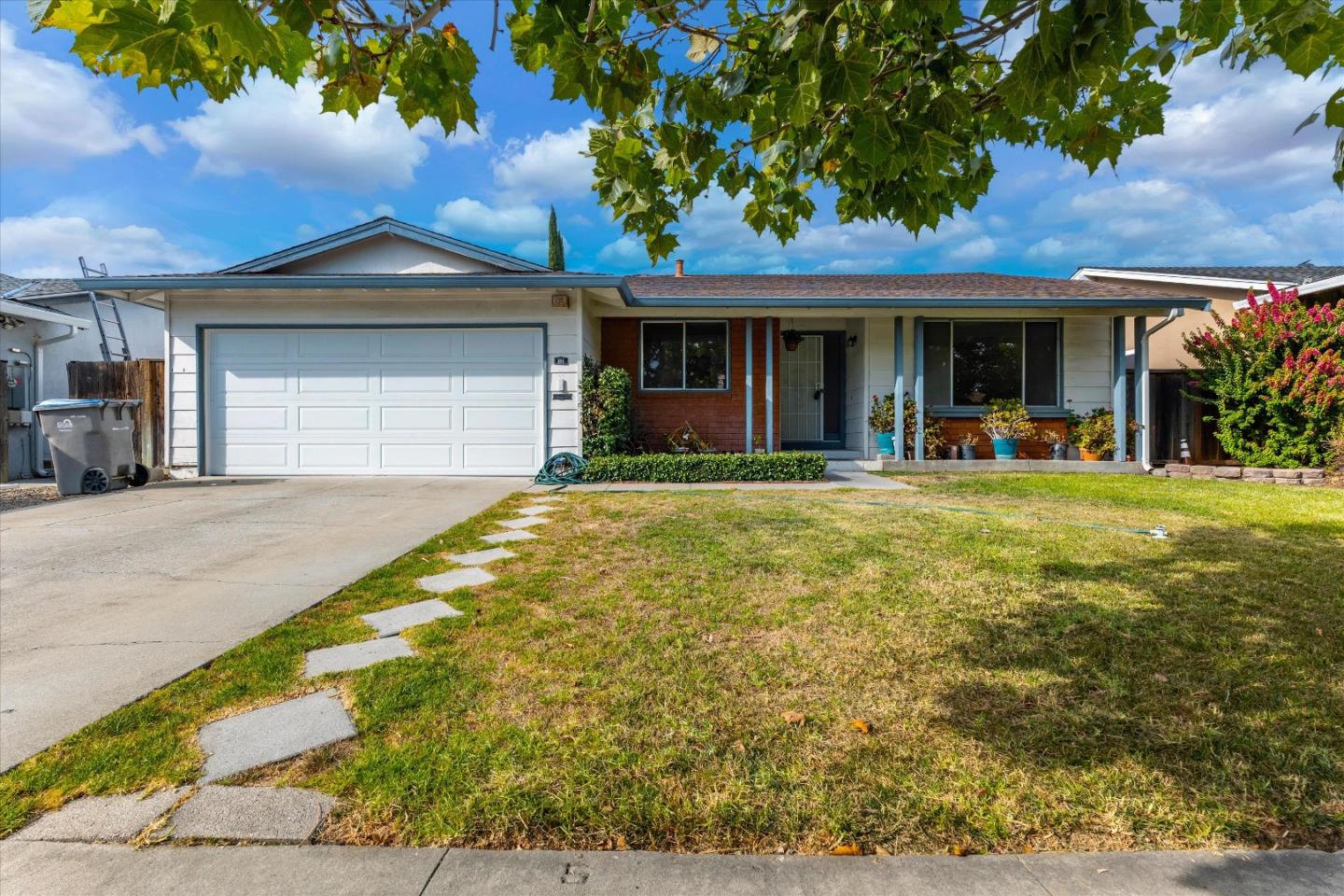 a front view of a house with a yard