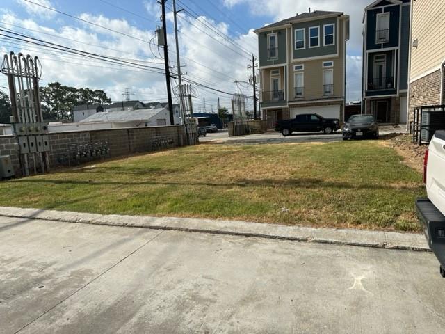 a view of a house with a yard in the background