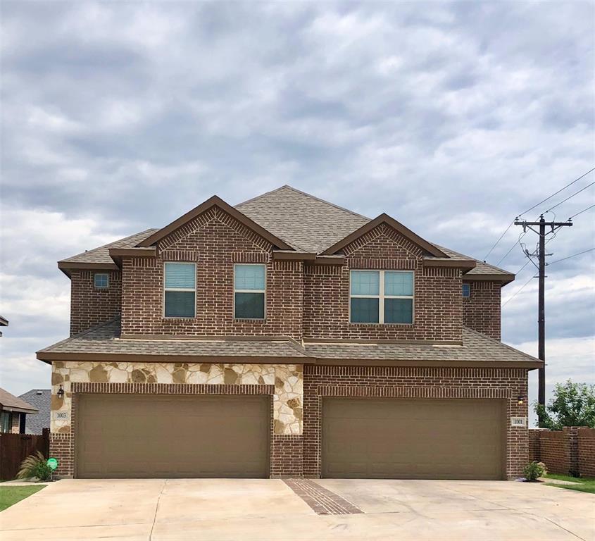 a front view of a house with yard