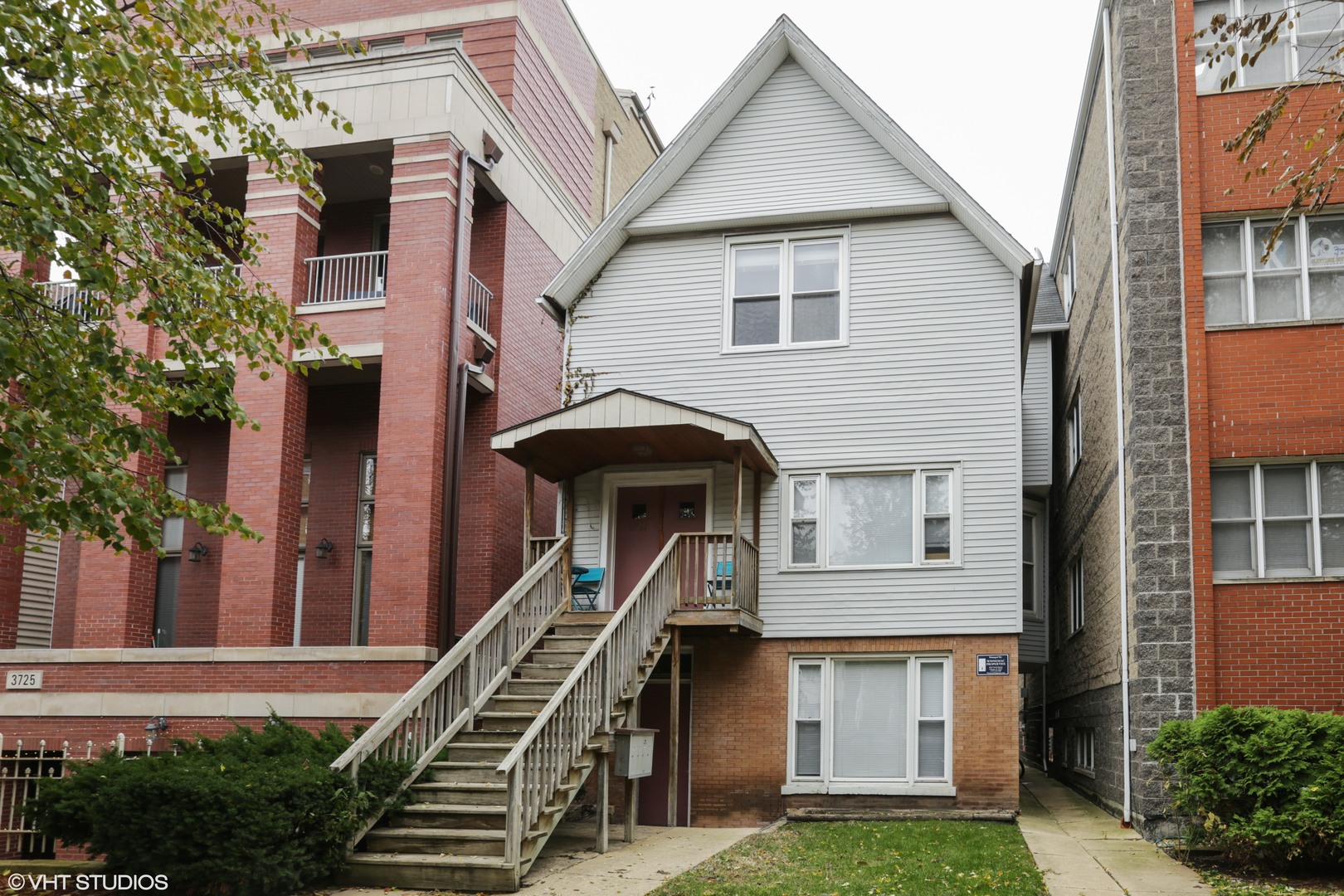 a front view of a house with stairs