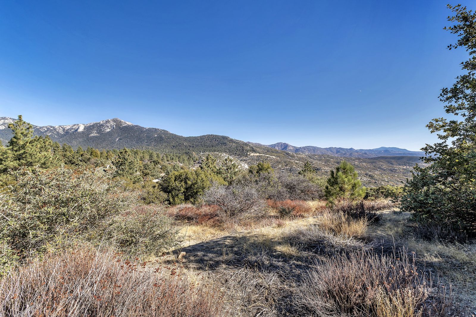 a view of mountain view with mountains in the background