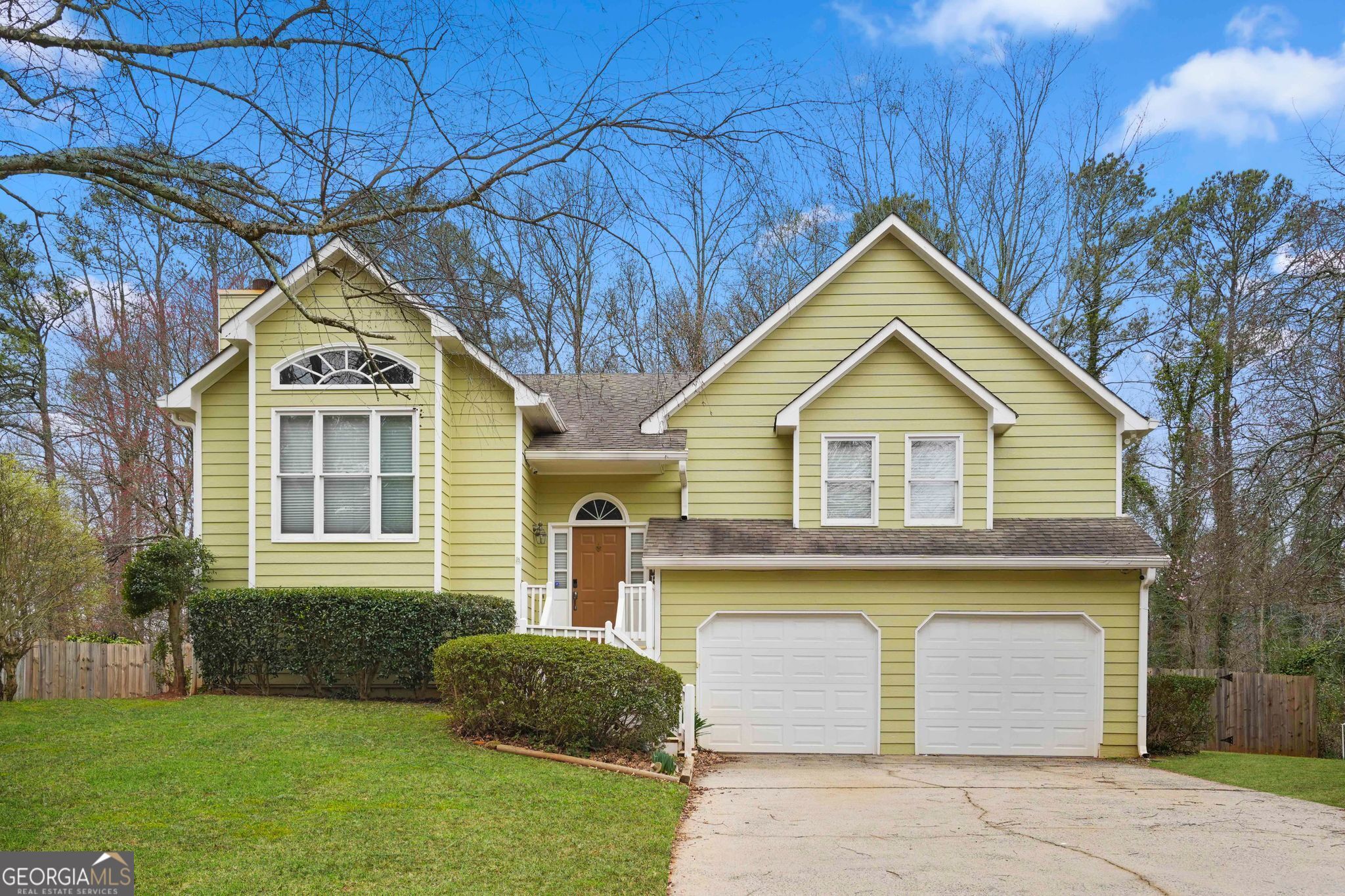 a front view of a house with a yard