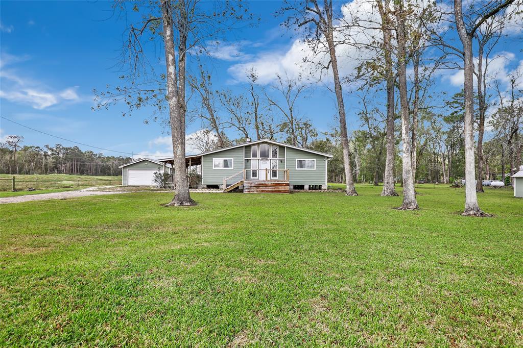 a view of a house with a big yard