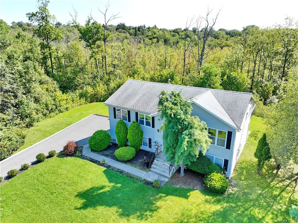 an aerial view of a house with a garden