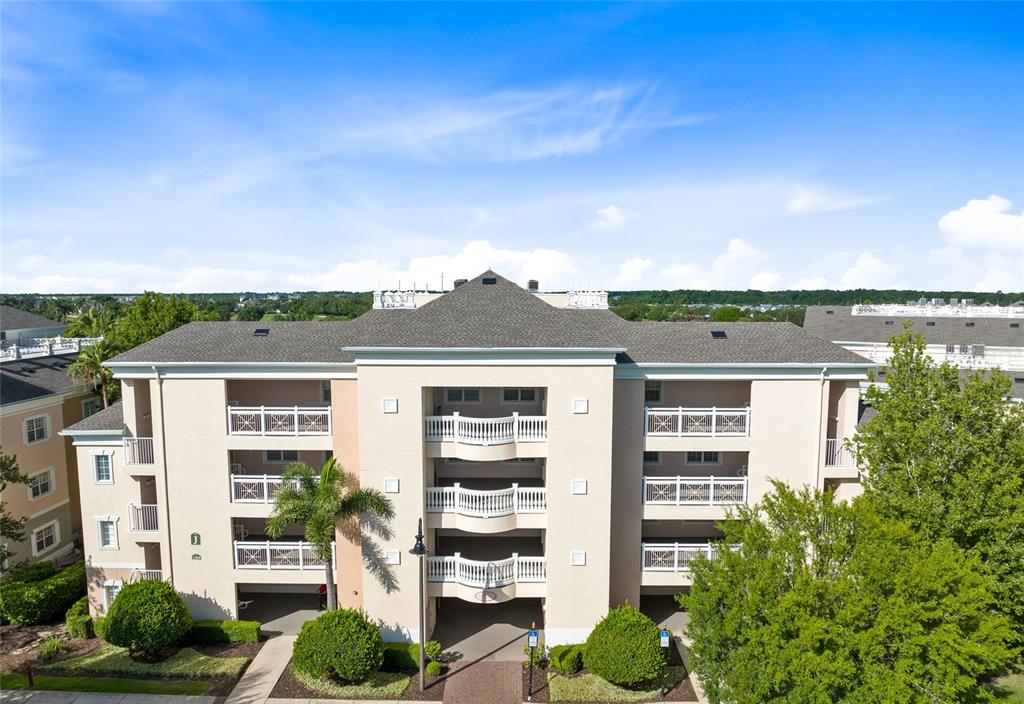 a front view of a residential apartment building with a yard