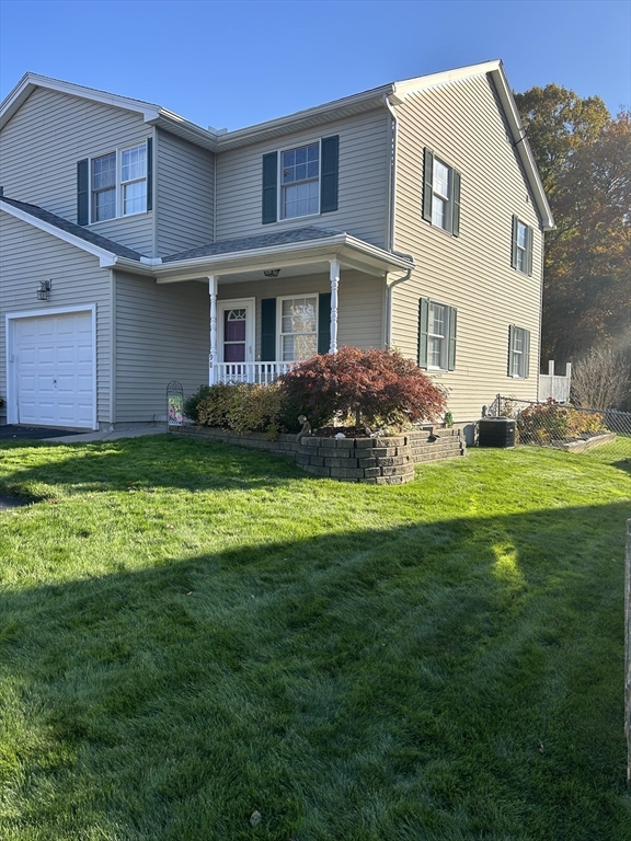 a front view of a house with a yard