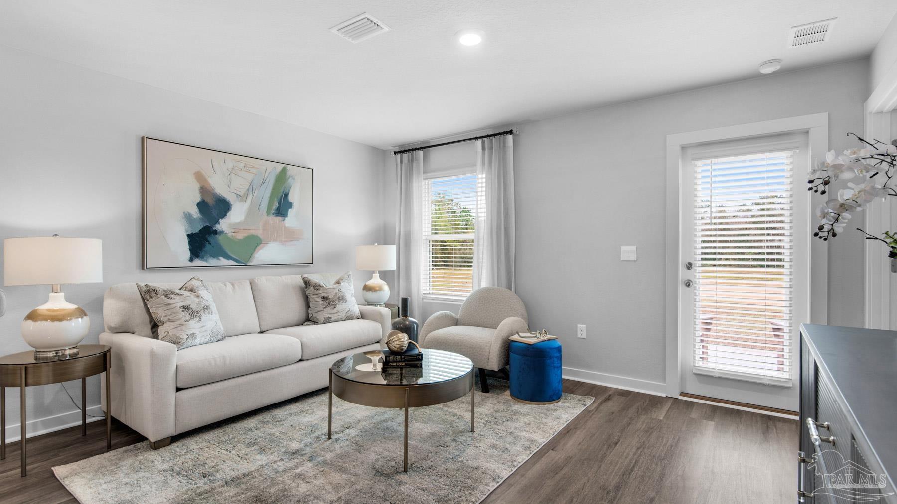 a living room with furniture and a window