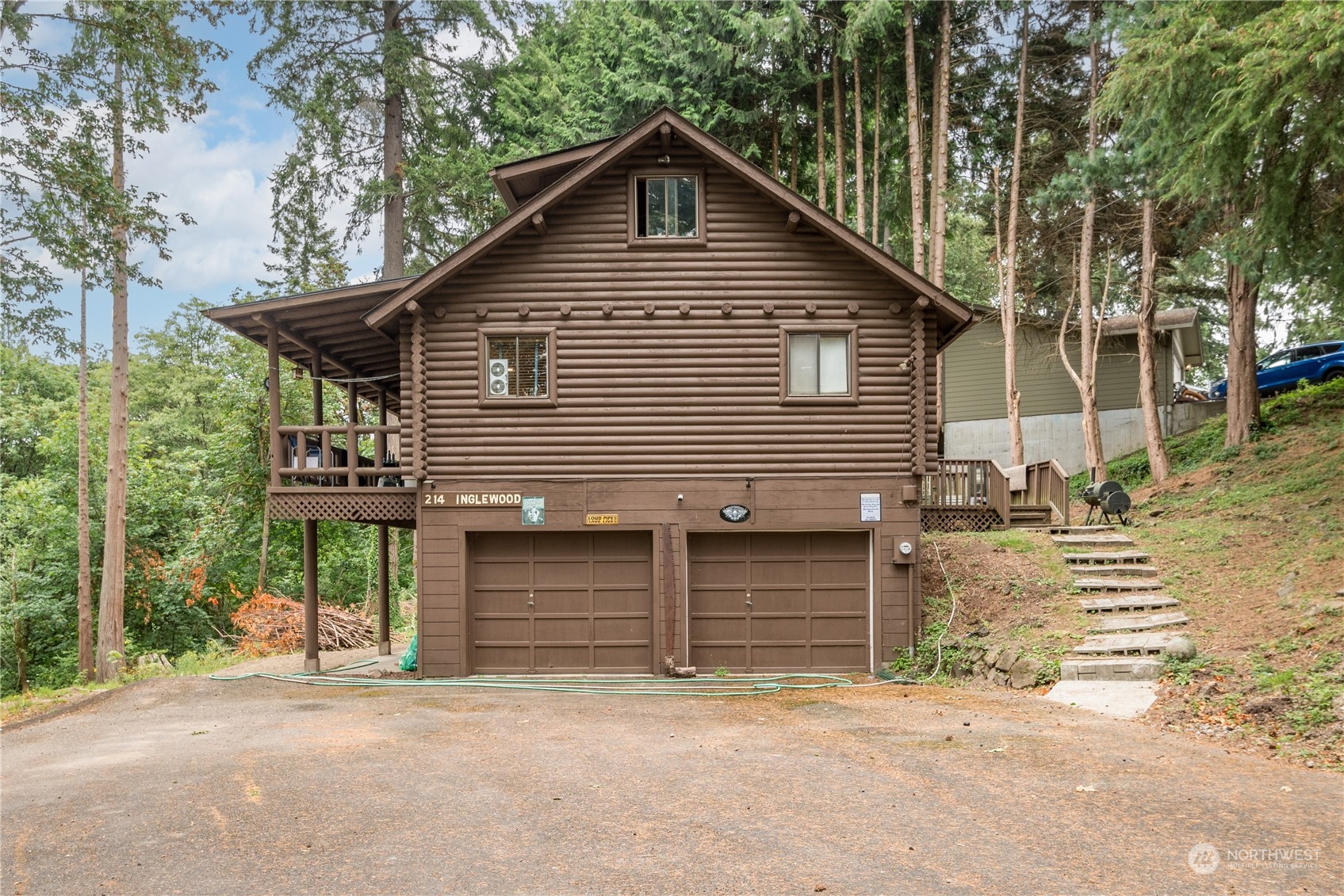 a front view of a house with garage