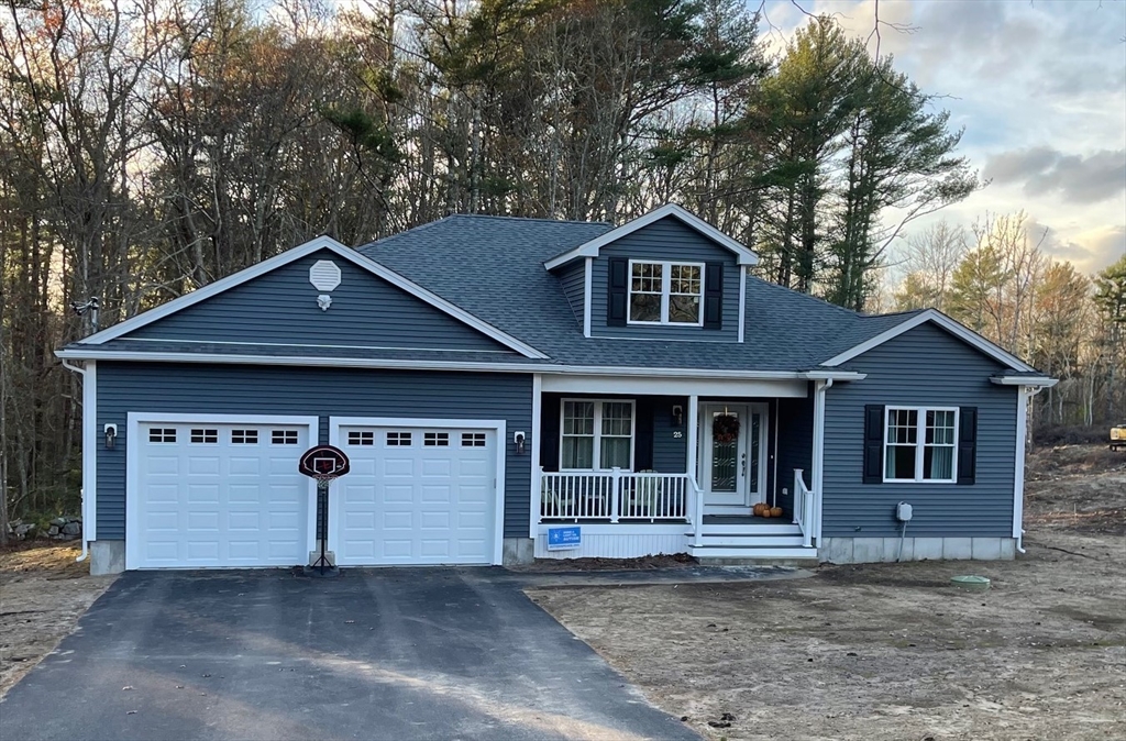 a front view of a house with a garage