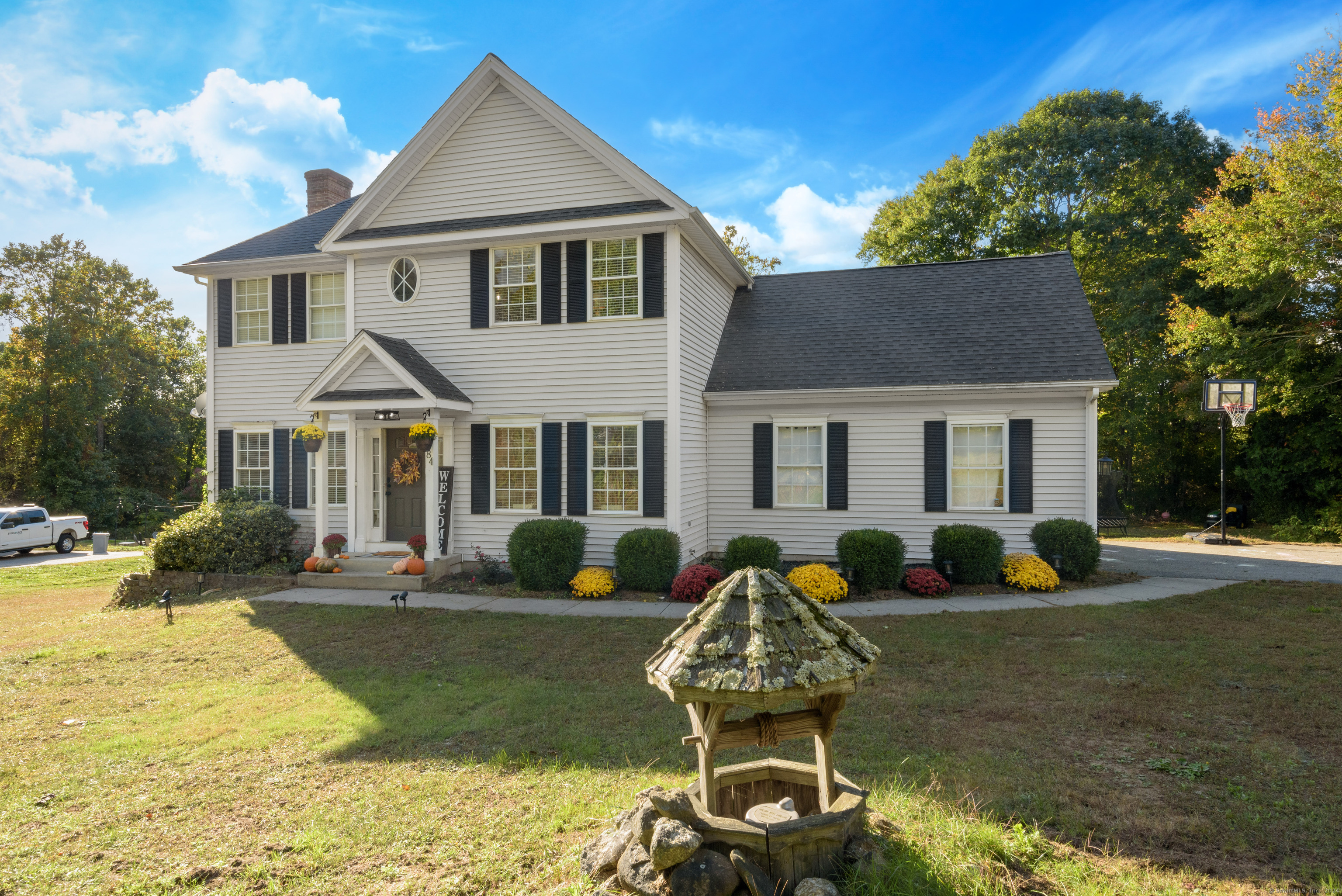 a front view of a house with garden and porch