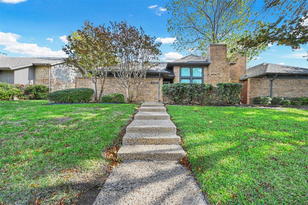 a front view of a house with yard