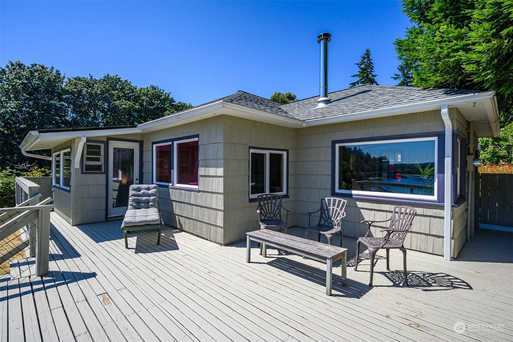 a front view of a house with outdoor seating