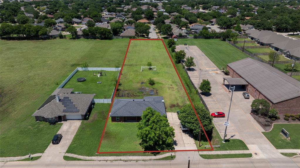 an aerial view of a house with a garden