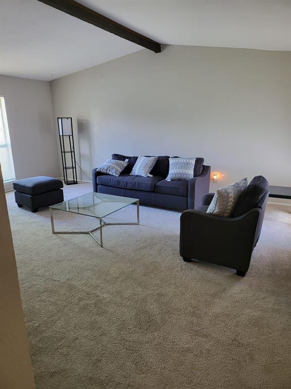 a living room with furniture and a couch