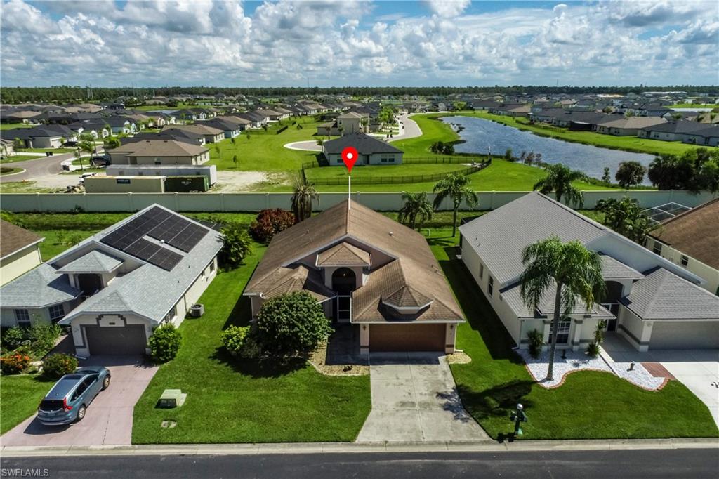 an aerial view of a house with a garden and plants