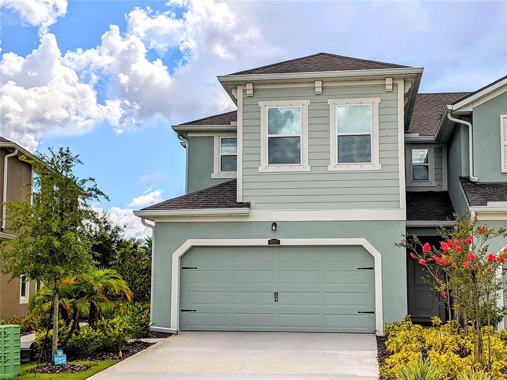 a front view of a house with a garage