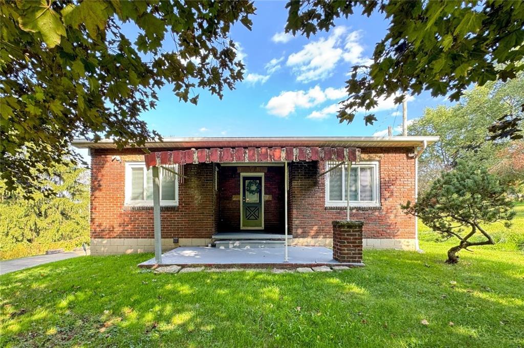 front view of a house with a yard