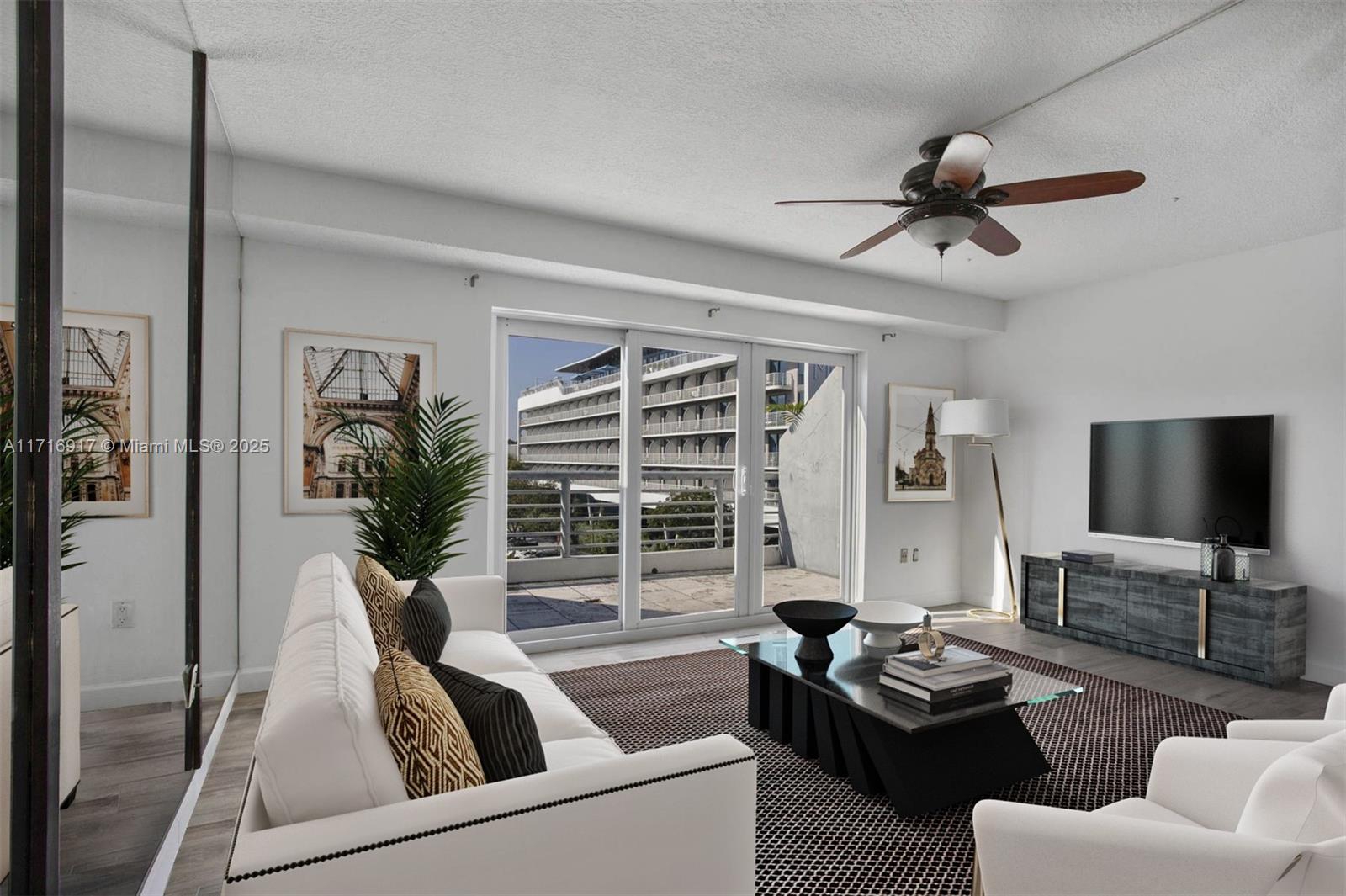 a living room with furniture and a flat screen tv