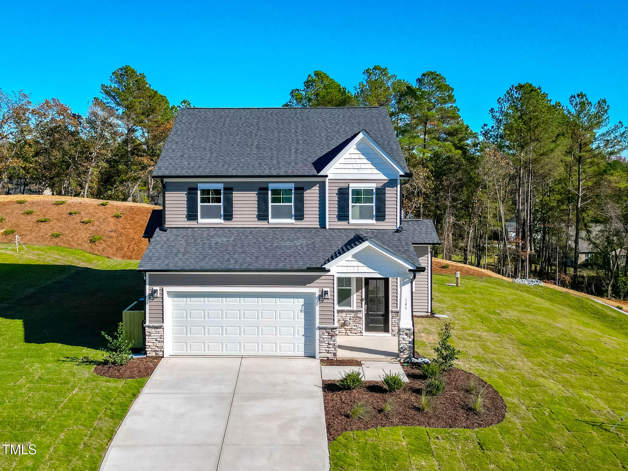 a front view of a house with yard