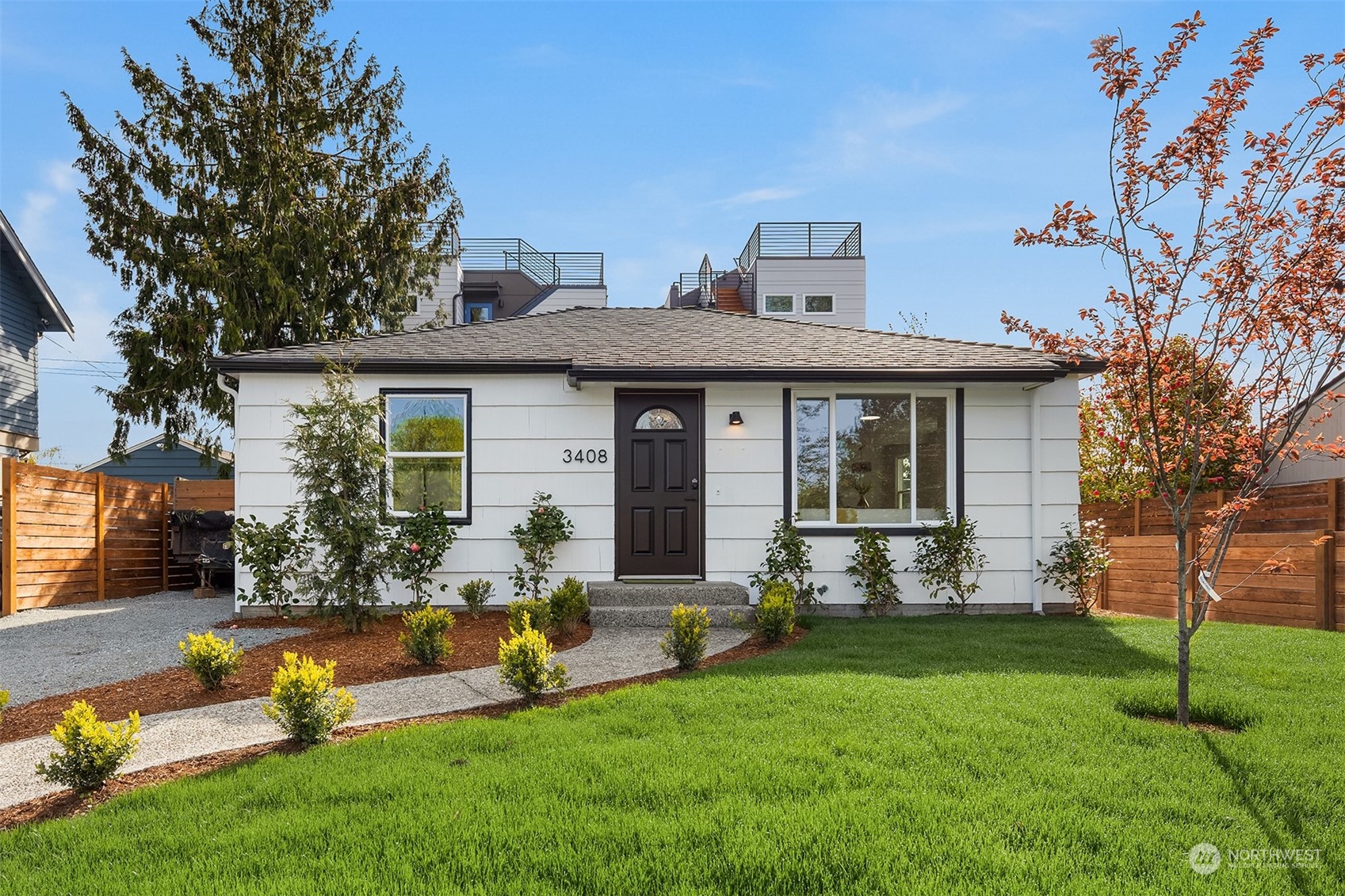 a front view of house with a garden and patio