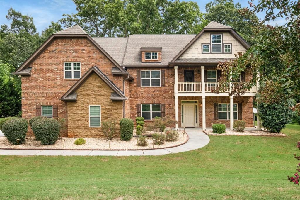 a front view of a house with a yard