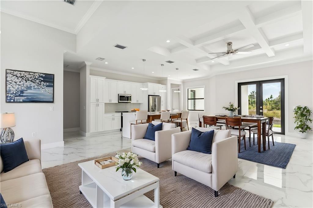 a living room with furniture dining table and a couch