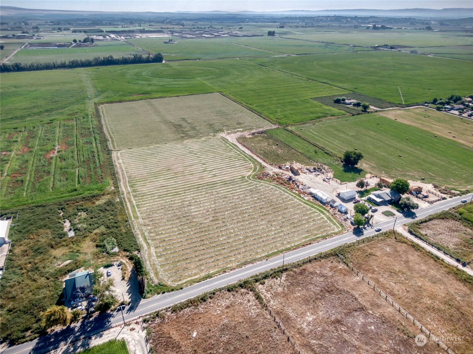 an aerial view of a house with a yard