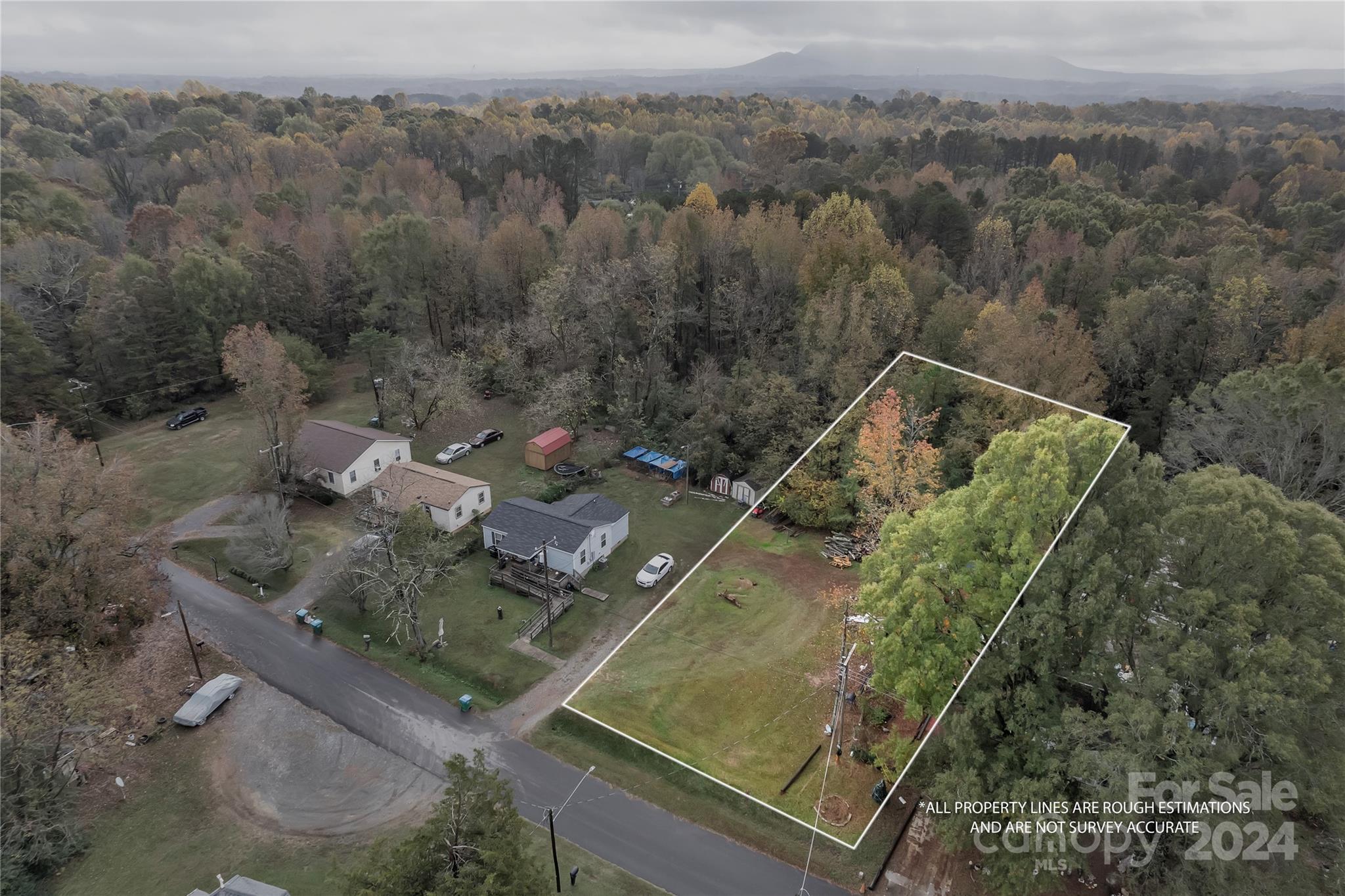 an aerial view of house with yard