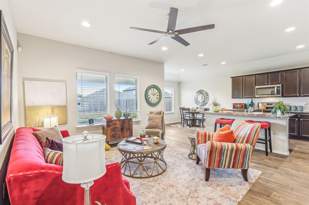 Bright, open living area with high ceilings and ample lighting.