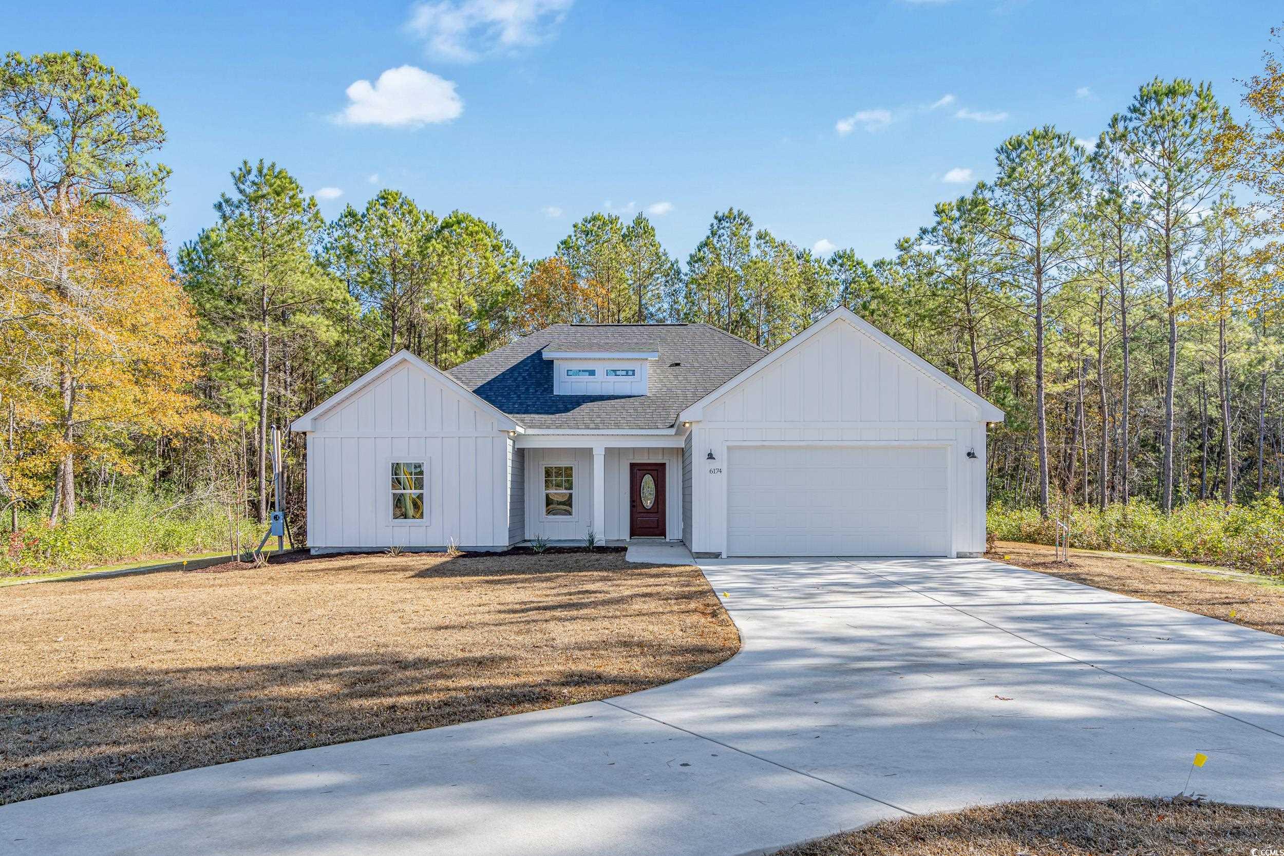 Modern farmhouse featuring a garage