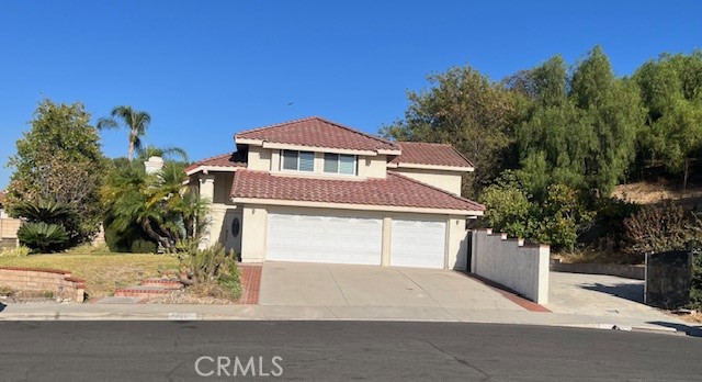 a front view of a house with a garage