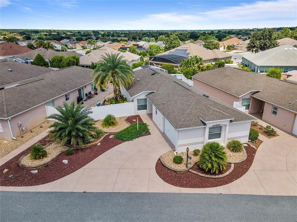 an aerial view of a house with a garden