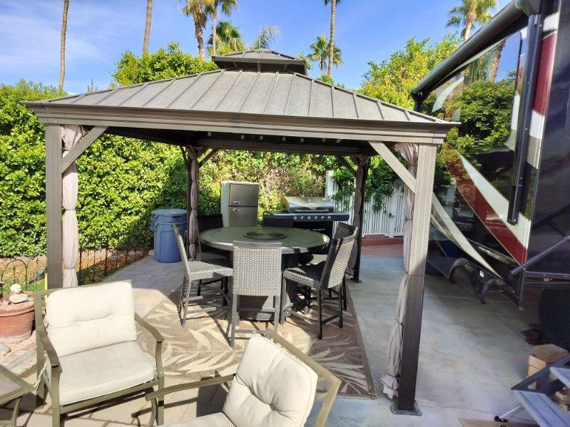 a patio with table and chairs