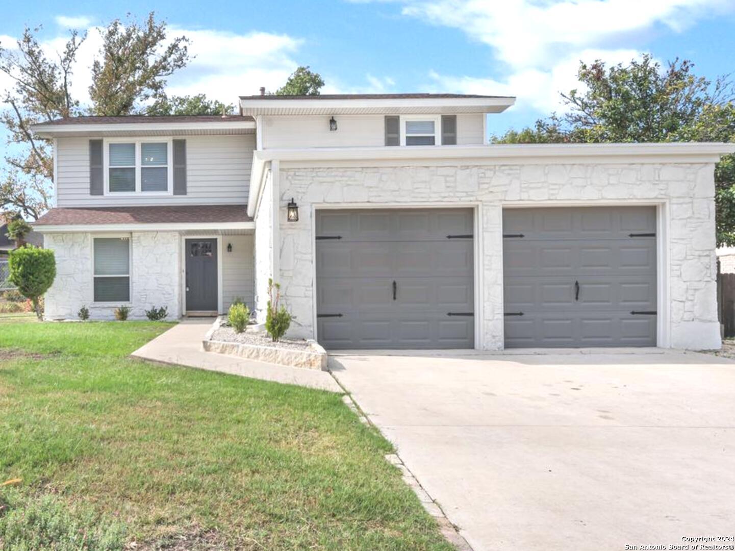 front view of a house with a yard