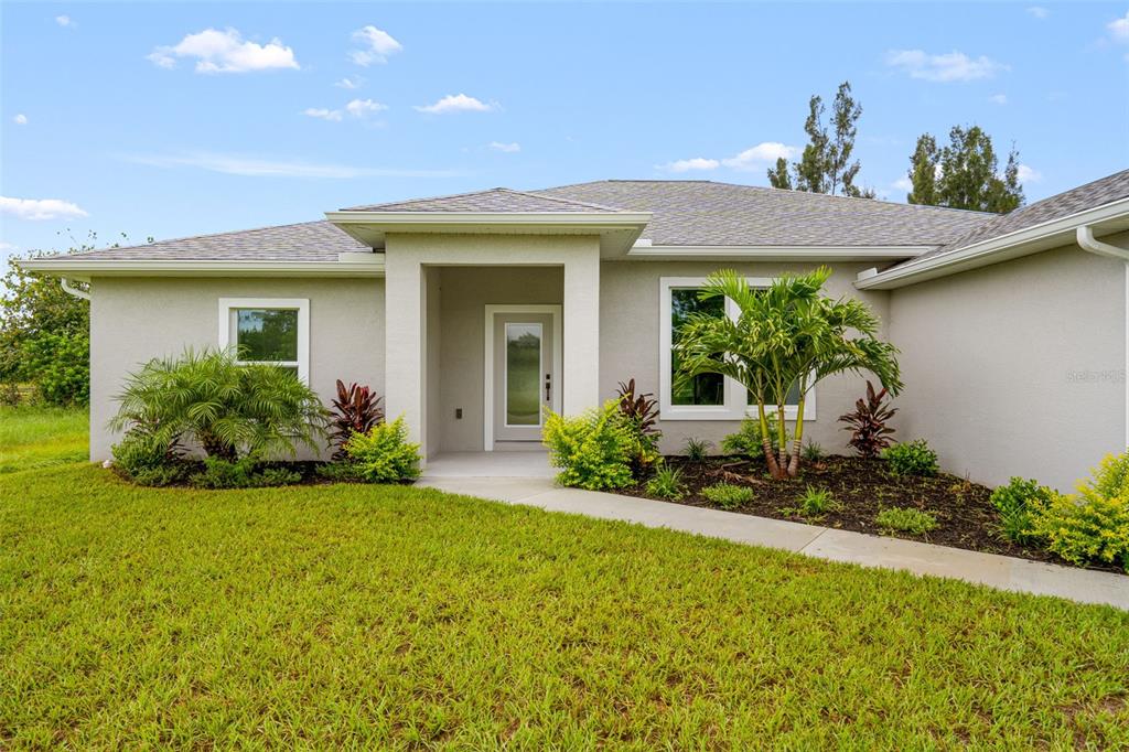 a front view of a house with a yard