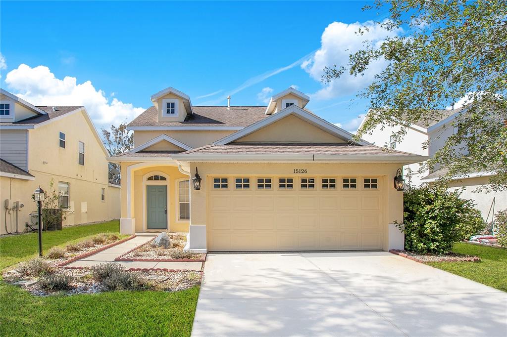 a view of a house with a yard