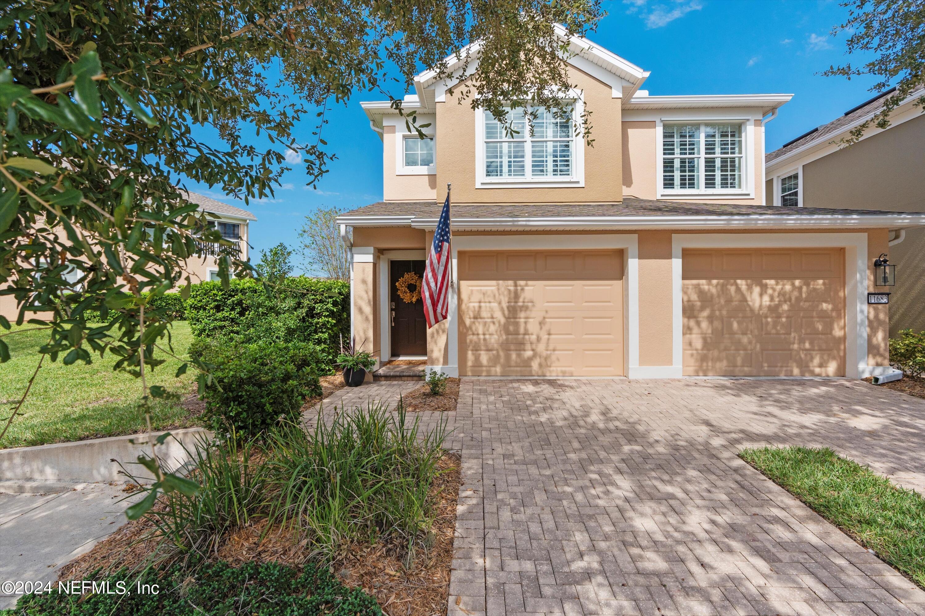 front view of a house with a yard