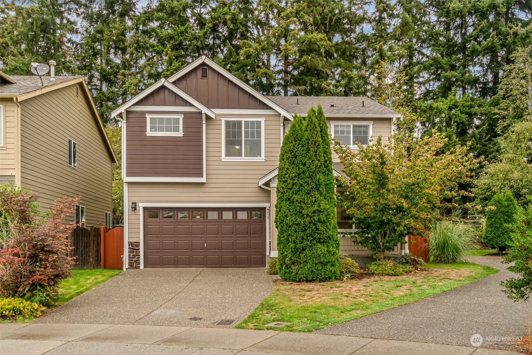 a front view of a house with a garden